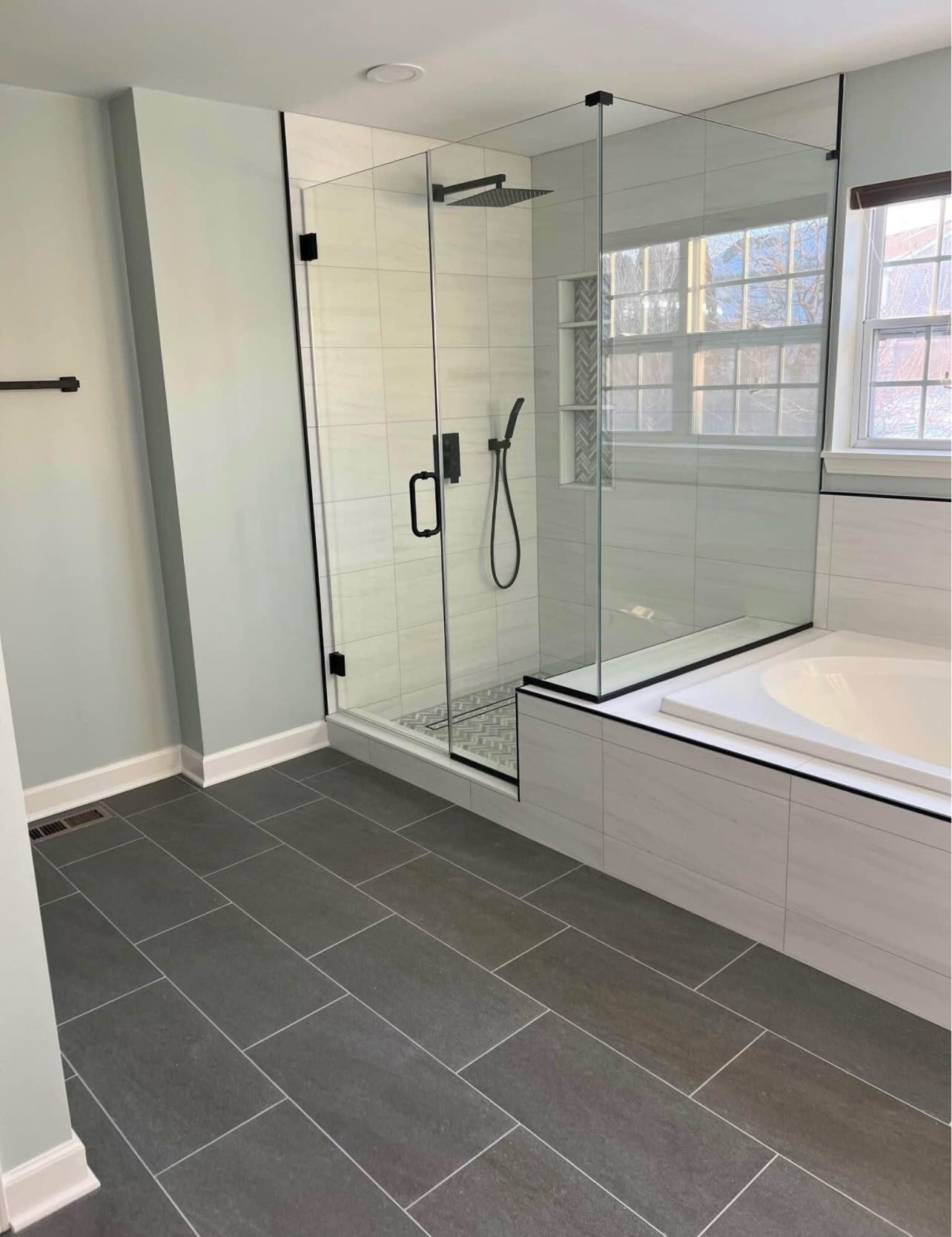 Master bathroom with glass shower and soaker tub renovation by LevelUp Renos, London Ontario